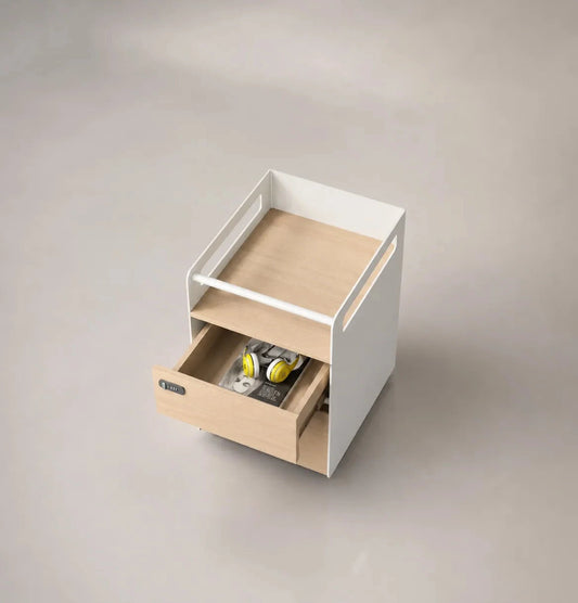 Small white and wooden storage unit with a drawer on a gray background